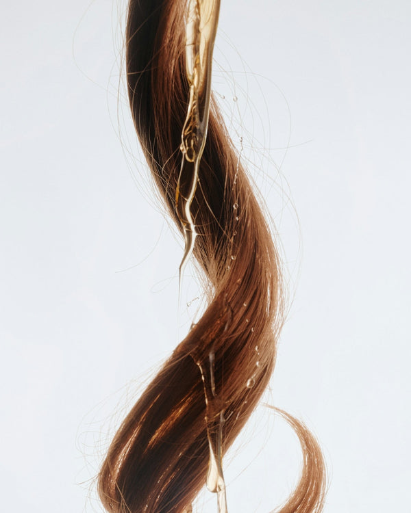 Keravive Serum on strands of hair