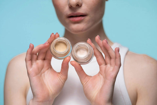 Woman holding skincare products