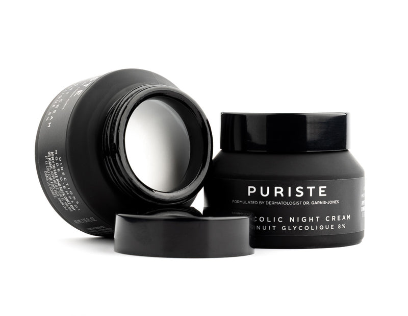 Black jars of Canadian skincare brand Puriste Glycolic Night Cream on a white background